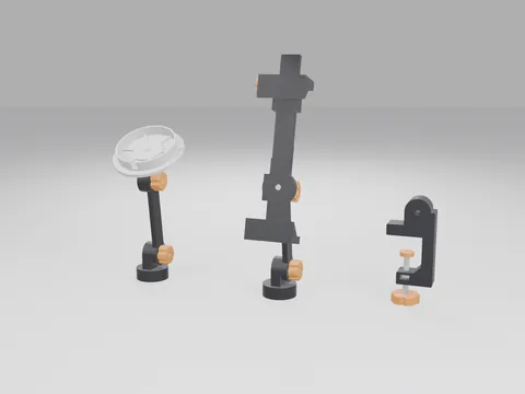 3D printed black mounting arms with orange knobs: a switch mount with a white round cup on a round base, a tablet mount with a tall cradle and sliding top jaw on a round base, and a black C-shaped desk clamp with its screw knob