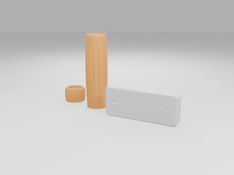 Orange 3D printed ribbed handle sleeve standing upright, a short orange ring-shaped test slice and a white rounded key-turner lever with a slot