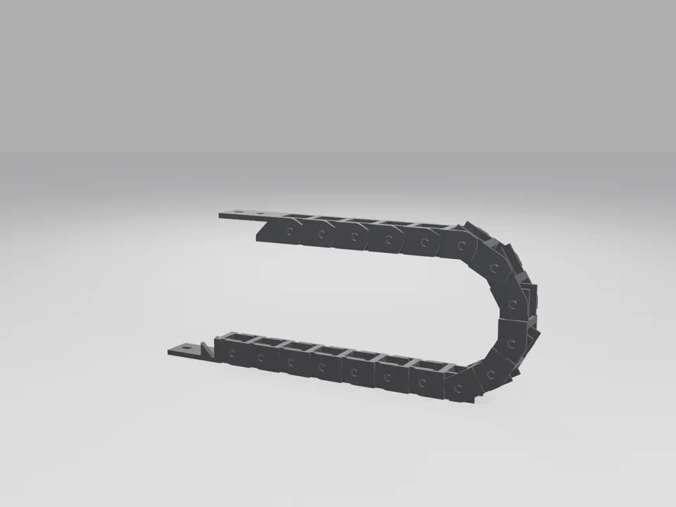 A black 3D printed cable drag chain of snap-together links bent into a U shape, each link with open sides and a top crossbar