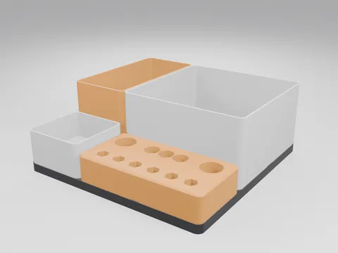 3D printed organiser set on a black 3x3 baseplate: white bins, an orange bin and an orange tool block with hex-bit pockets