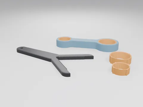 A black 3D printed jar twist-aid with a toothed V-shaped jaw and long handle, a blue two-head bottle-cap opener with orange soft grip sleeves fitted, and a spare orange sleeve of each size
