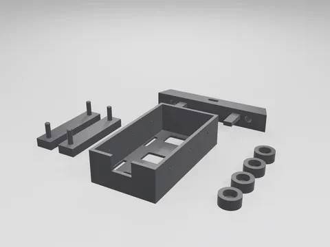 Black 3D printed micro-crawler parts: a slotted battery tray, a stubby front bumper with two round LED buckets, two pinned magnet bars and four small magnet cups