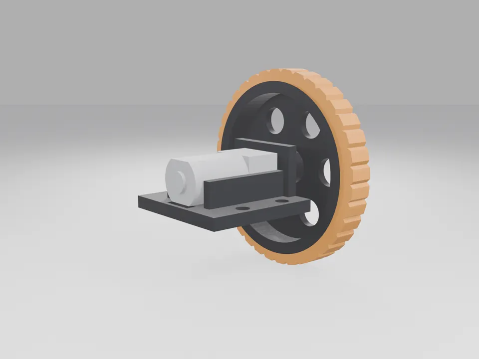 A plain metal-coloured block motor stand-in in the black bracket, with the black wheel and orange tyre on its shaft