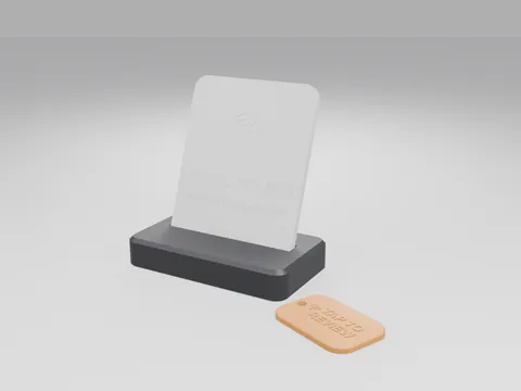 Black 3D printed counter stand holding a white NFC face plate with a tap icon, next to an orange tap-to-review keyring tag