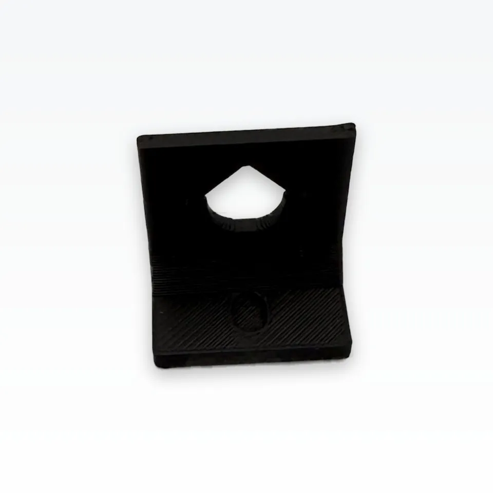 Black 3D printed camera L-bracket with a teardrop lens window and four small screw holes