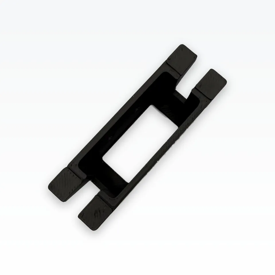 Top view of a black 3D printed servo bracket showing the 41.4 x 20.6 mm servo window and slotted feet