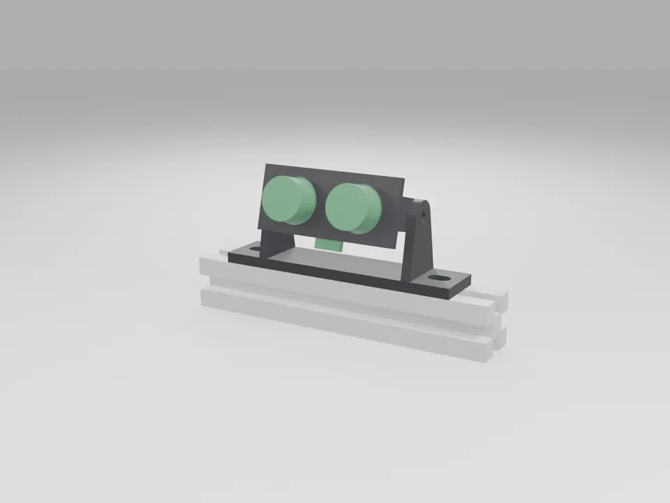 A plain green board with two round cans held in the black holder, on its tilt base on a grey aluminium extrusion